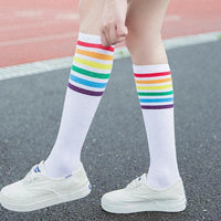 Women's striped knee-high cotton socks by MANDOTOS, featuring colorful horizontal stripes and comfortable, breathable fabric.