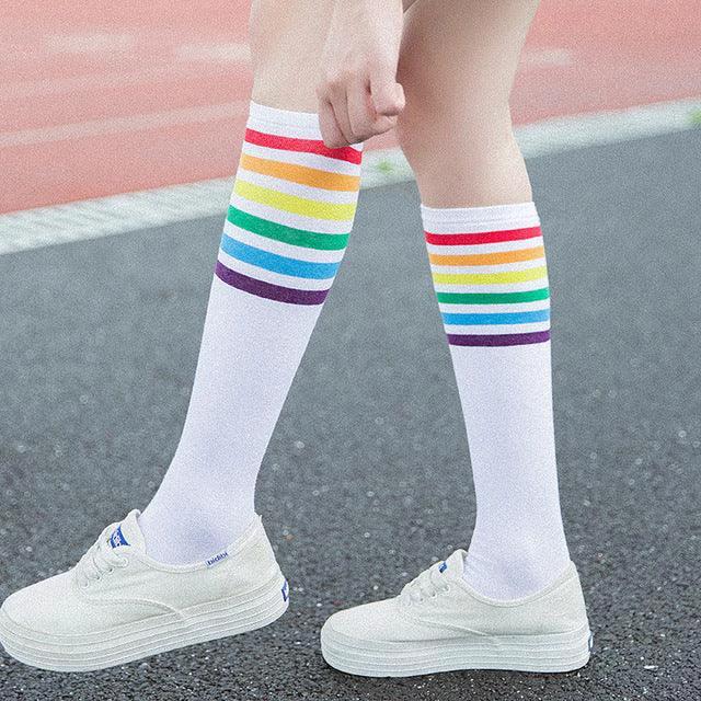 Women's striped knee-high cotton socks by MANDOTOS, featuring colorful horizontal stripes and comfortable, breathable fabric.
