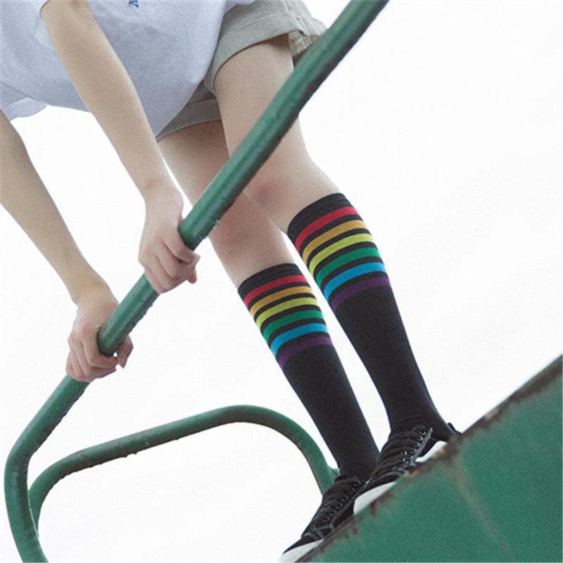 Women's striped knee-high cotton socks by MANDOTOS, featuring colorful horizontal stripes and a comfortable fit.