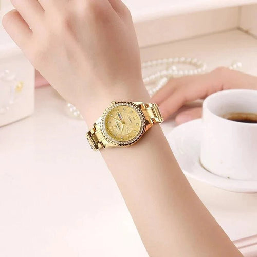 Mandotos WWOOR Elegance gold diamond quartz watch with a sleek design and sparkling accents on the dial.