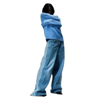 Mandotos Y2K baggy jeans with embroidered striped details, wide-leg denim sweatpants for men and women, streetwear style.