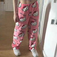 Mandotos Y2K Hello Kitty pajama pants featuring cartoon Hello Kitty design, comfortable women's sleepwear trousers for home leisure.