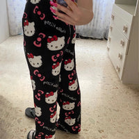 Mandotos Y2K Hello Kitty pajama pants featuring Sanrio anime cartoon print, comfortable women's sleepwear trousers for home lounging.