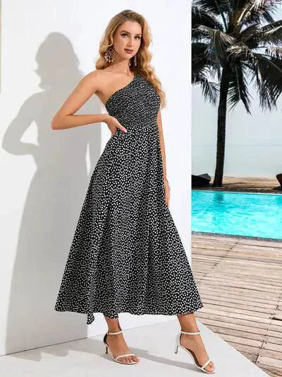 Mandotos Zoe asymmetrical midi dress featuring a flowing silhouette and stylish design, perfect for elegant daytime wear.
