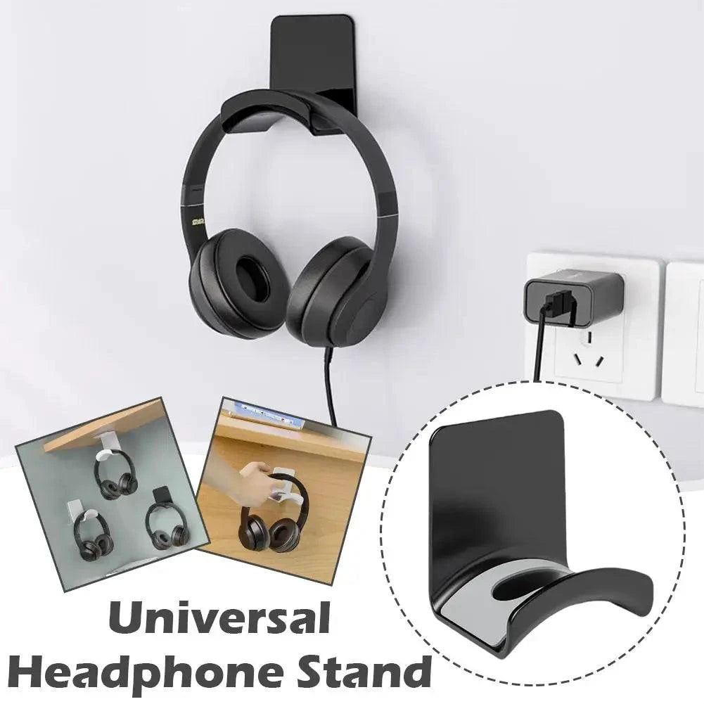 Plastic wall-mounted headphone stand with adhesive backing, designed for gaming headset and earphone organization under desk.