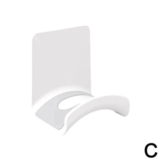 Universal headphone stand mounted on wall, plastic hanger supporting gaming earphones and headset under desk storage.
