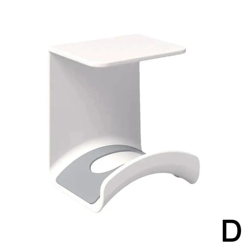 Plastic wall-mounted headphone stand and gaming headset holder with adhesive strip for under-desk earphone organization.