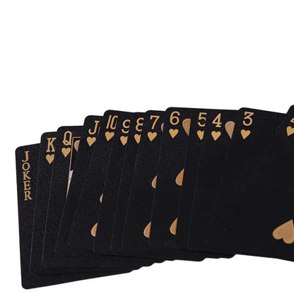 Black and gold waterproof playing cards from Dmagic, featuring a poker suit design, ideal for card games and magic tricks.
