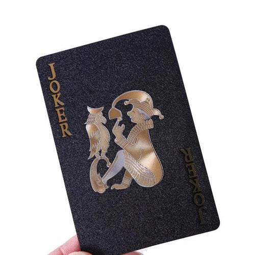 Black and gold playing cards by Dmagic, waterproof poker suit, ideal for card games and magic tricks, perfect for collections.