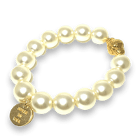 Pearls of Wisdom mantra bracelet by The Urban Charm featuring white beads and engraved spiritual message on a stylish bracelet.