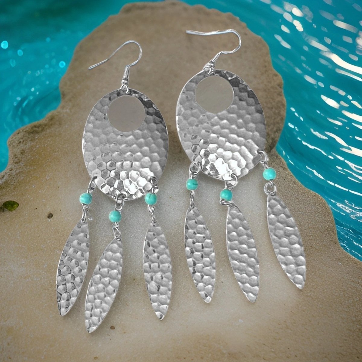 Turquoise accent Navette dream catcher earrings with feathers by The Urban Charm, showcasing intricate metalwork and boho style.
