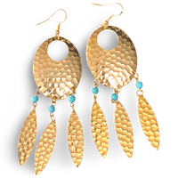 Navette dream catcher earrings by The Urban Charm featuring turquoise accents and feather details, hanging from silver hooks.