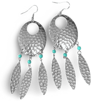 Navette Dream Catcher earrings by The Urban Charm featuring turquoise accents and feather details, hanging with intricate design.